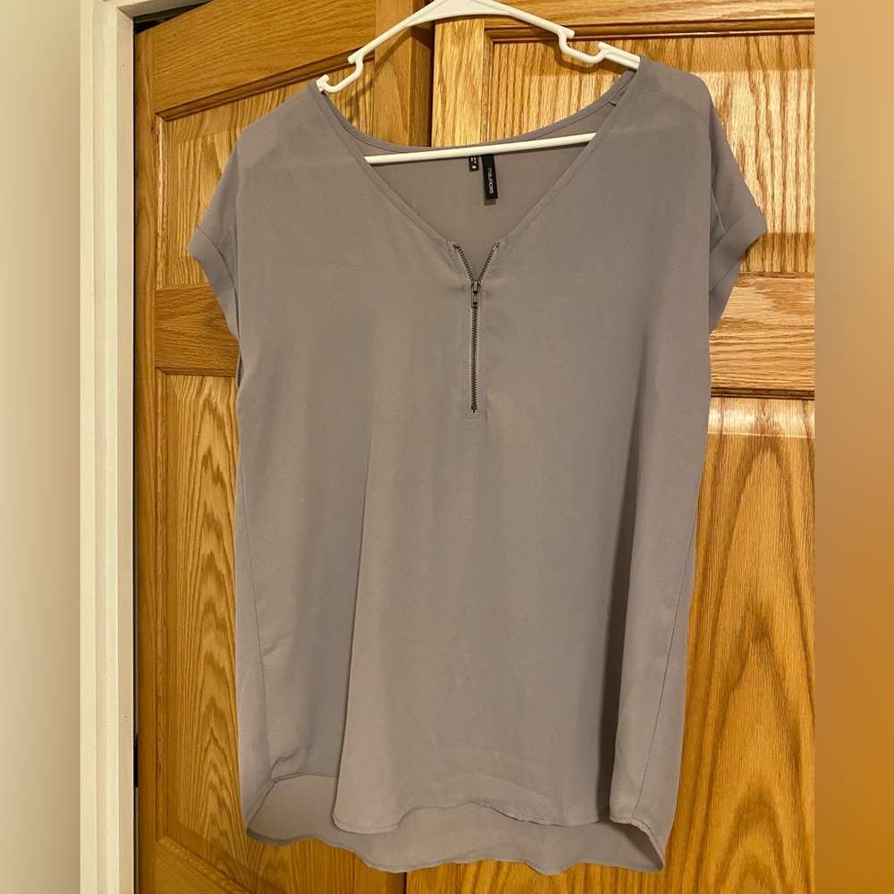 Maurice’s. Greyish/purple blouse. Size medium.